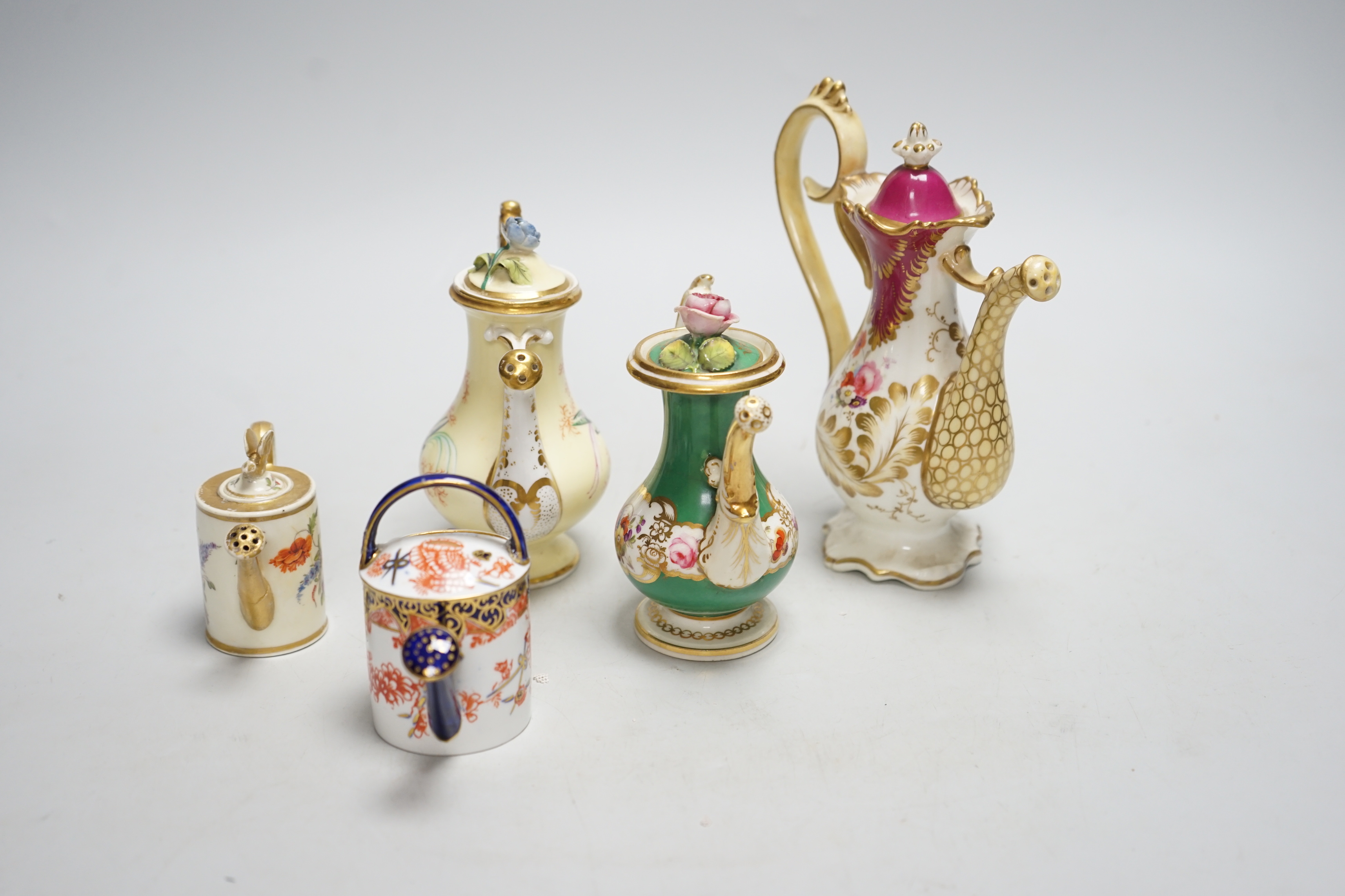 Five 19th/20th century rose water sprinklers by Royal Crown Derby, Davenport, etc. tallest 16cm